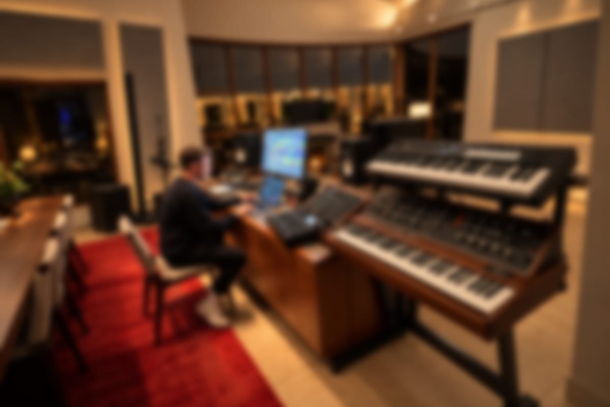 Dolby Atmos immersive studio with synthesizers and fireplace
